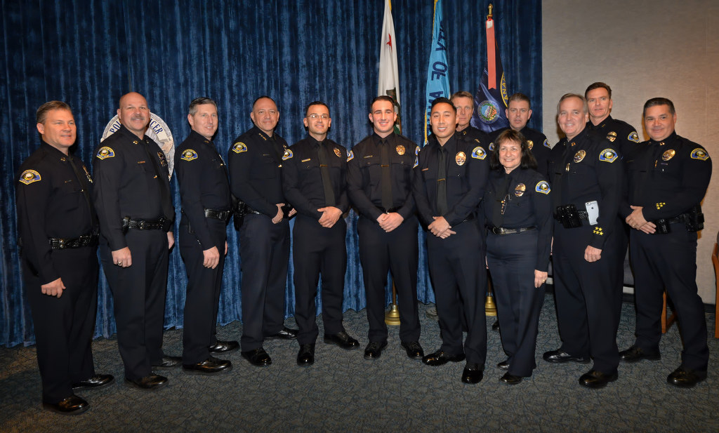Anaheim PD’s newest officers stand with the APD command staff after a promotion ceremony at police headquarters. Photo by Steven Georges/Behind the Badge OC