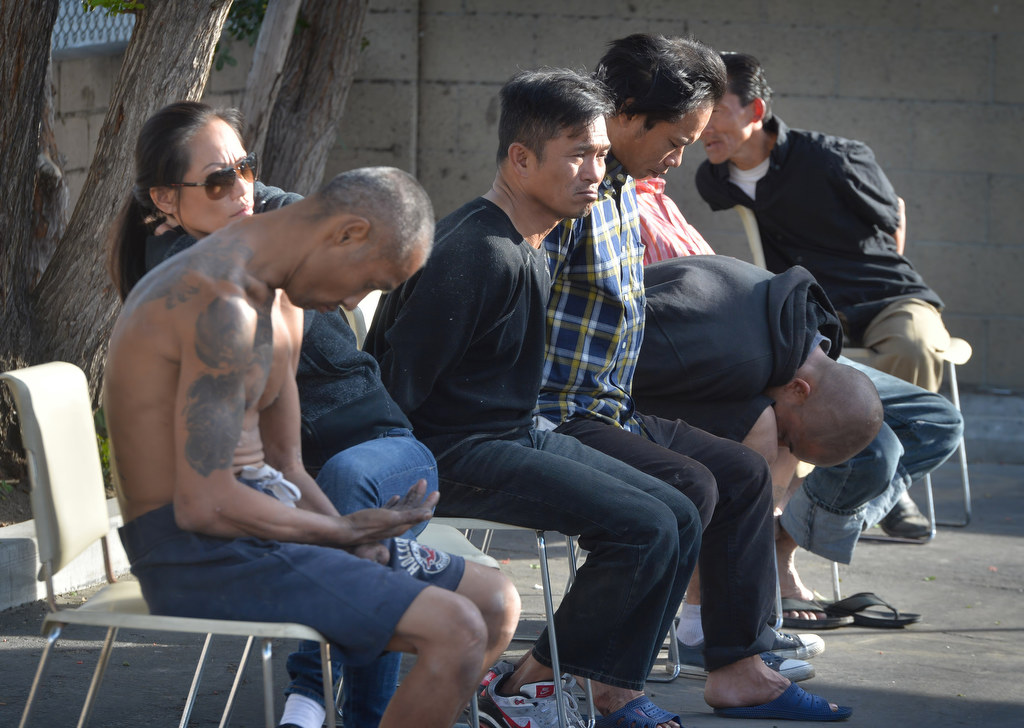 People detained, who were found in or near the storm drain tunnels under Brookhurst St. when Garden Grove PD conducted a sweep, wait for processing. Photo by Steven Georges/Behind the Badge OC