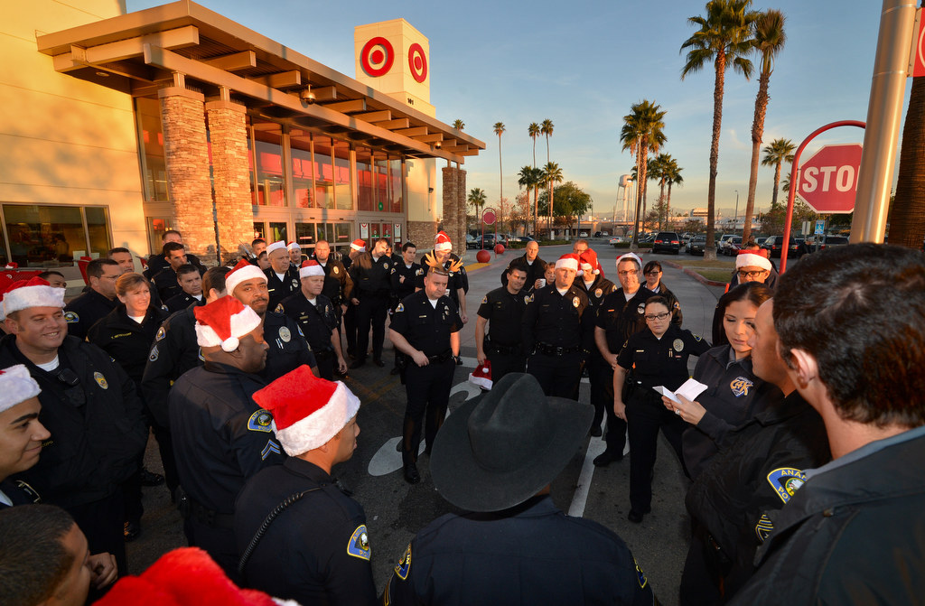 Anaheim PD officers gather for instructions before taking kids into the Target store in Anaheim for the annual Shop With a Cop event. Photo by Steven Georges/Behind the Badge OC