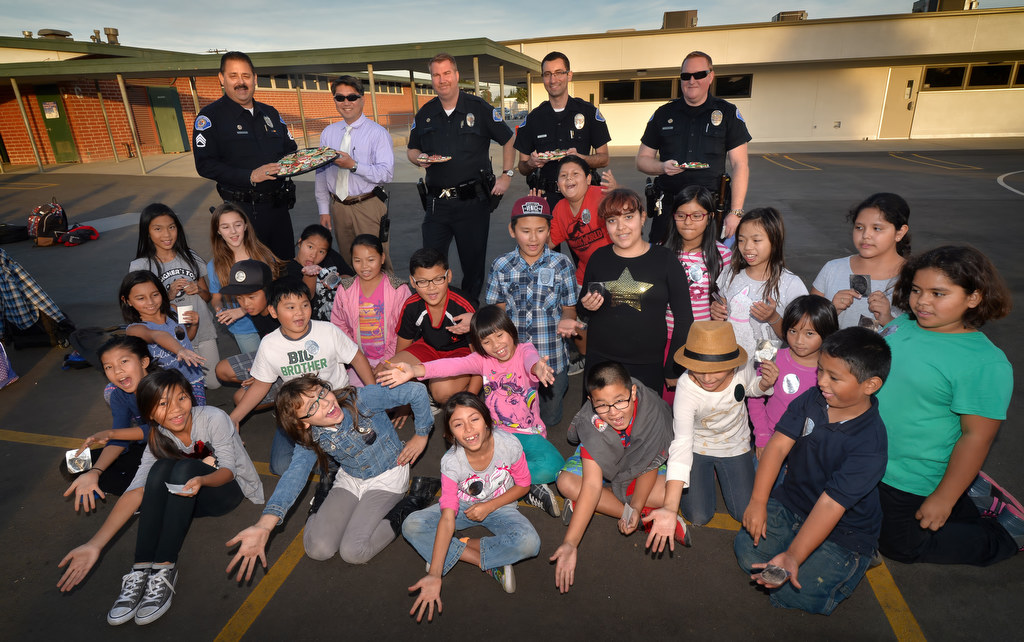 Kids from Post Elementary School and the Boys & Girls Club of Garden Grove, with Garden Grove PD officers during a visit to the school. The school is in Westminster but is part of the Garden Grove Unified School District. Photo by Steven Georges/Behind the Badge OC