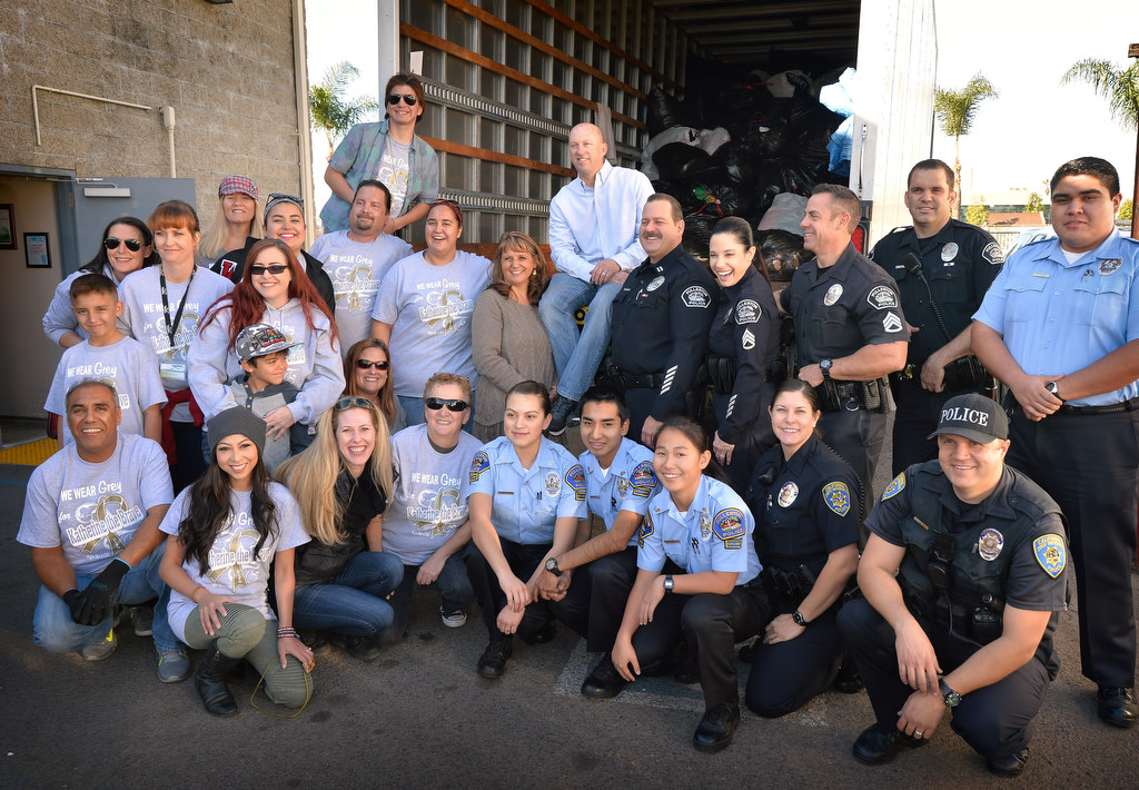 Fullerton PD personal and Clothes For The Cause helpers gather at the donation drop off point at Bootlegger’s Brewery in Fullerton to, in part, raise money for 6-year-old Katherine King who suffers from an incurable brain stem tumor. Photo by Steven Georges/Behind the Badge OC
