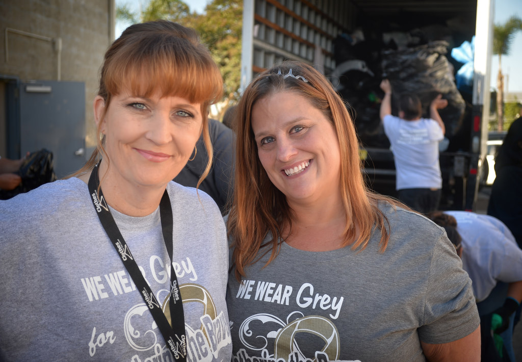 Amanda Mandy Galarza, event planer for Clothes for the Cause, left, with Jenni Parker, family friend of the King and LaShorne family, at the fundraiser in Fullerton. Photo by Steven Georges/Behind the Badge OC
