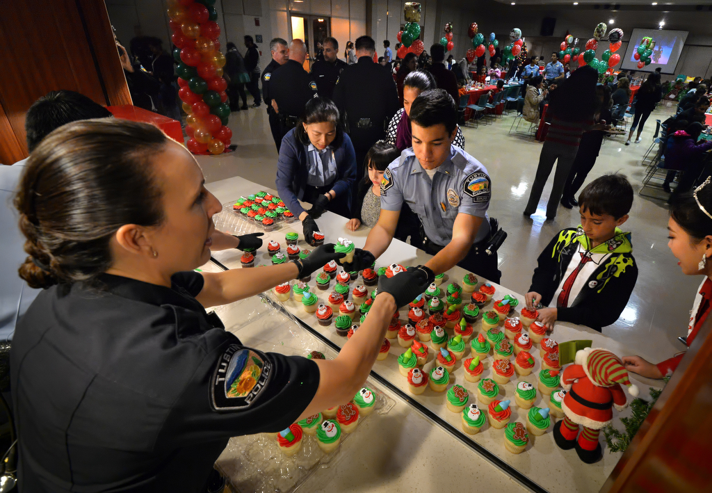 Cupcakes are set out for families attending Tustin PD’s annual “Santa Cop” at the Tustin Community Center. Photo by Steven Georges/Behind the Badge OC