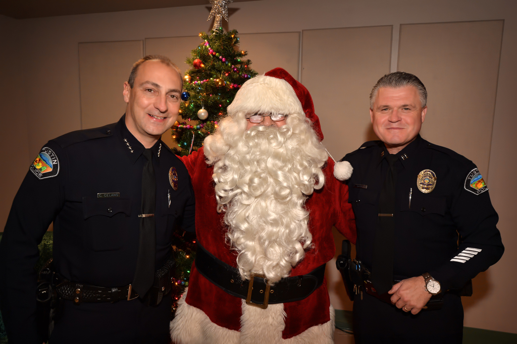 Santa with Tustin Police Chief Charles Celano, left, and Capt. Paul Garaven during Tustin PD’s annual “Santa Cop” at the Tustin Community Center. Photo by Steven Georges/Behind the Badge OC