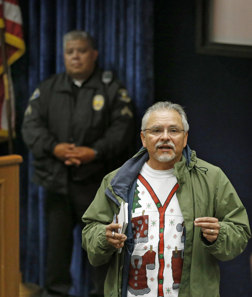 Retired Anaheim Police Captain Joe Vargas addresses a group of volunteers who came together to deliver Christmas gifts and food to needy families in the community. Photo by Christine Cotter/Behind the Badge OC