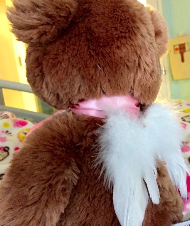 One volunteer sewed angel wings on the back of the girl's teddy bear.