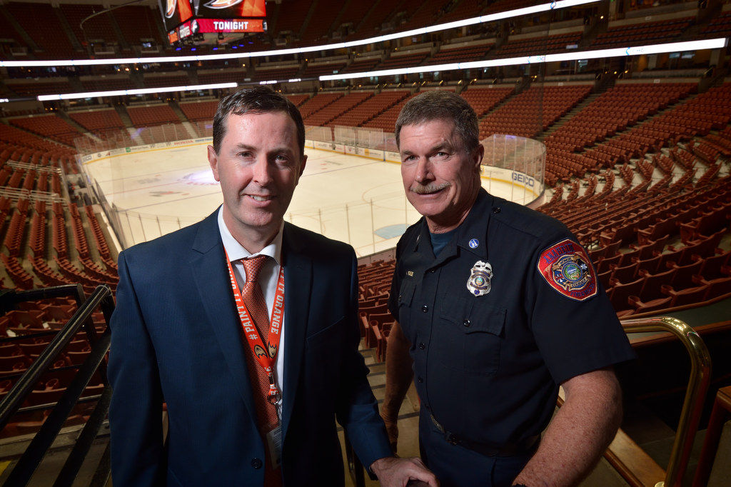 Quinn Mackin, director of events for the Honda Center, left, with Allen Hogue, assistant fire marshal for Anaheim Fire & Rescue at the Honda Center. Photo by Steven Georges/Behind the Badge OC