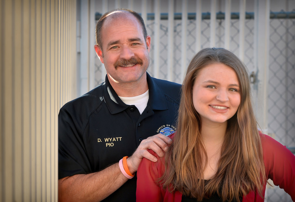 Anaheim PD Sgt. Daron Wyatt with his daughter Lindsey Wyatt at Valencia High School where she held a Love is Kindness donut and hot chocolate fundraiser. Photo by Steven Georges/Behind the Badge OC