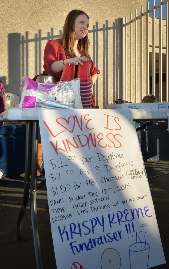 Lindsey Wyatt holds a Love is Kindness donut and hot chocolate fundraiser at Valencia High School. Photo by Steven Georges/Behind the Badge OC