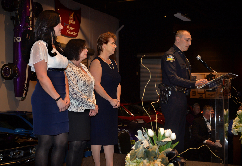 Police Services Officers Megan Evans, left, Marilyn Packer and Adriana Tokar receive the Community Service Award from Tustin Police Chief Charles Celano during the Tustin Police Department's Awards Banquet. Photo by Steven Georges/Behind the Badge OC