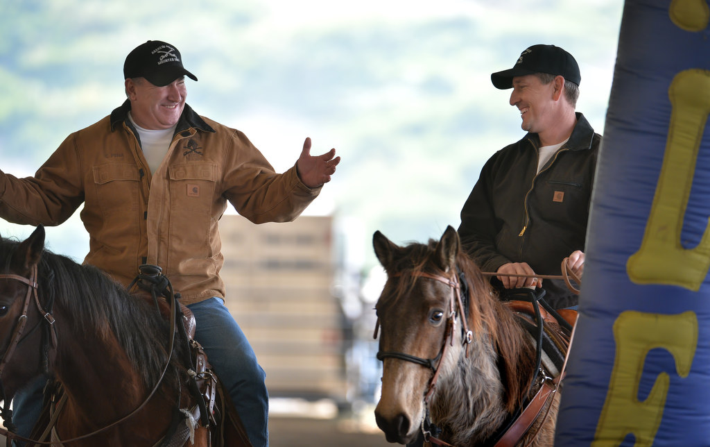 Anaheim Police Lt. Chris Pena, left, talks with Deputy Chief Dan Cahill as they take their horses on sensory training at the George Ingalls Equestrian Event Center in Norco. Photo by Steven Georges/Behind the Badge OC