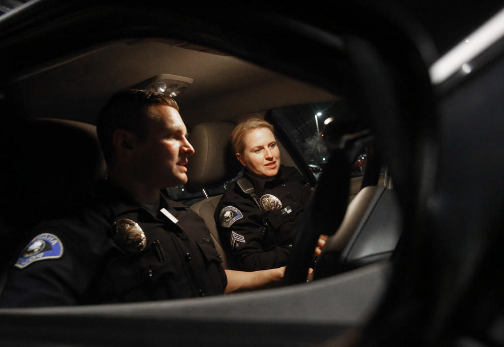 Anaheim Police Department Field Training Officer Kacey Costa works with trainee Anthony McGlade during a recent graveyard shift. Photo by Christine Cotter/Behind the Badge OC