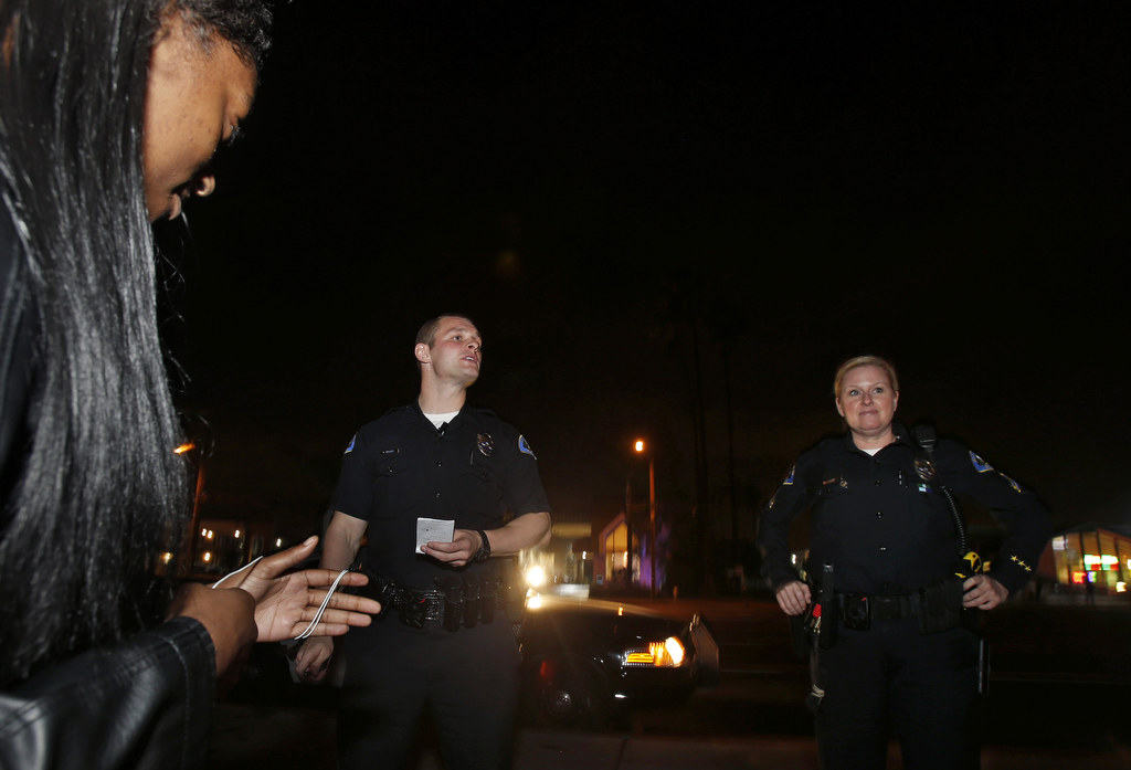 Anaheim Police Department Field Training Officer Kacey Costa and trainee Anthony McGlade make a stop along Beach Blvd. for suspected prostitution during a recent graveyard shift. Photo by Christine Cotter/Behind the Badge OC