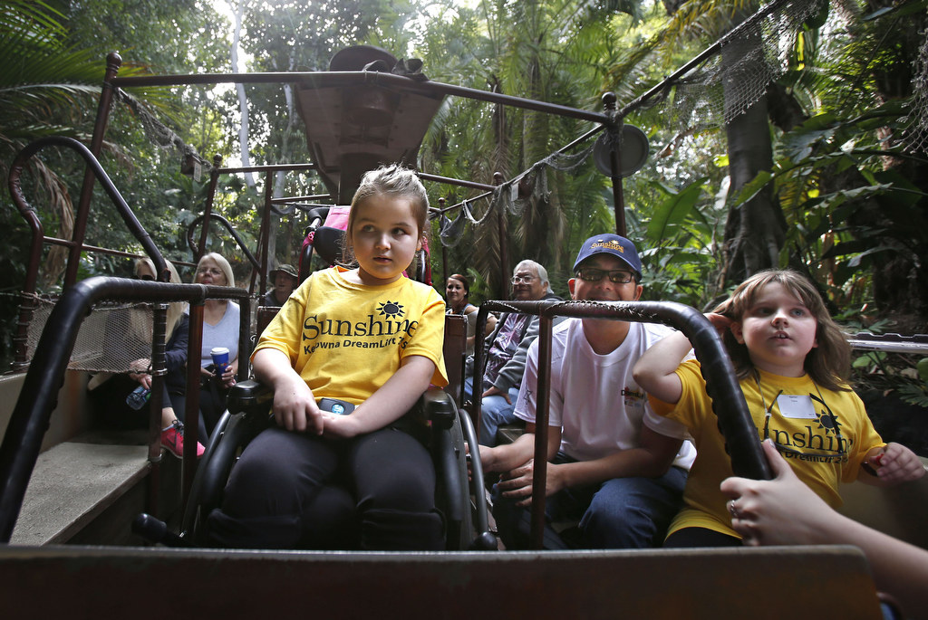 Tori Maria Foort, left and Kaitlyn Cone, right, are treated to a ride on Disneyland's "Jungle Cruise" during their daylong visit to the theme park. The Orange County Sheriff's Advisory Council and Canada's Sunshine Foundation worked together to provide the children with a day of fun at Disneyland. Photo by Christine Cotter