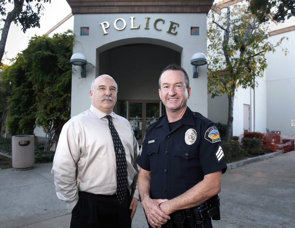 Capt. Steve Lewis, left, and Sgt. Dana Harper are long-time Tustin officers who are retiring this month. They served in the academy together and are retiring from TPD together.  Photo by Christine Cotter/Behind the Badge OC