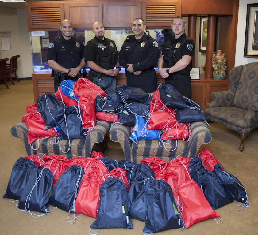 Officers from Fountain Valley, Garden Grove, Westminster and Tustin police departments raised money to deliver care packages for chemotherapy patients. Photo by Miguel Vasconcellos/Behind the Badge OC. 