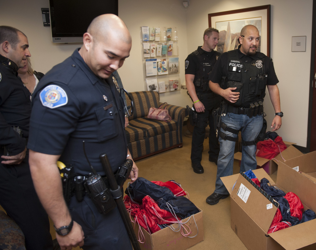 Officers from several Orange County agencies dropped off more than 60 care packages for cancer patients in Fountain Valley. Photo by Miguel Vasconcellos/Behind the Badge OC. 