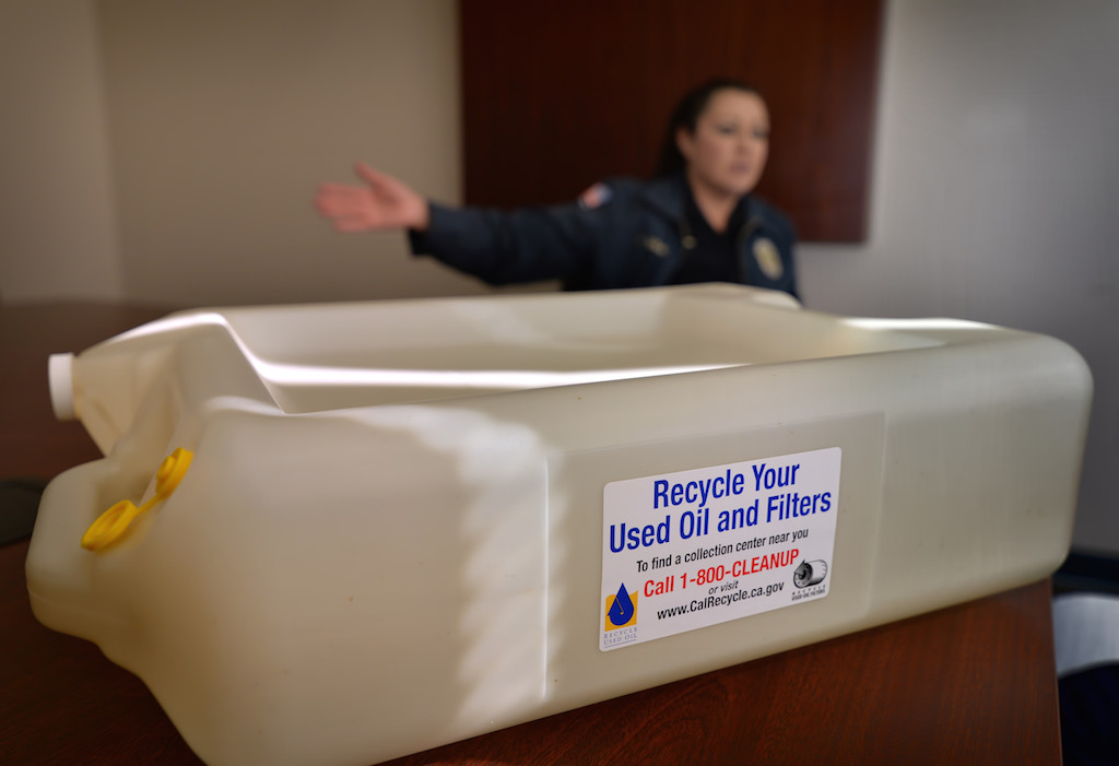 A motor oil recycling container given out to Anaheim residents at no charge to be used and reused. Free oil filter recycling is also included with the program. Photo by Steven Georges/Behind the Badge OC