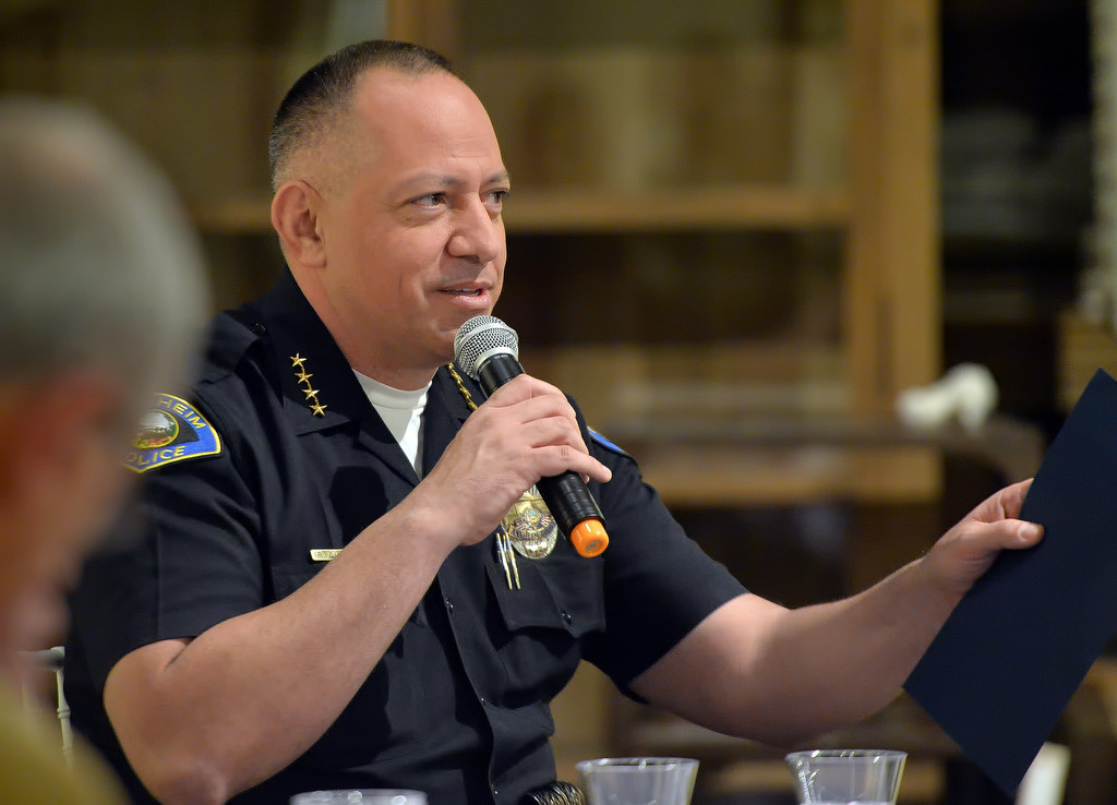 Anaheim Police Chief Raul Quezada talks about the Orange County Family Justice Center and its roll in helping the victims of domestic violence during a panel discussion at the opening of the Voices exhibit at the Randy Higbee Gallery in Costa Mesa. Photo by Steven Georges/Behind the Badge OC
