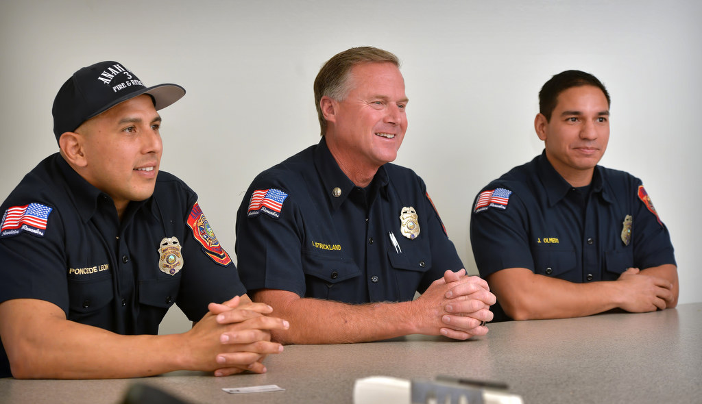 Anaheim Fire & Rescue Firefighter Manny Ponce de Leon, left, Captain John Strickland and Firefighter Jericho Olmedo about the upcoming 25th Annual Scott Firefighter Stairclimb in Seattle, 69 floors of stairs and 1,356 steps to raises money for The Leukemia & Lymphoma Society. Photo by Steven Georges/Behind the Badge OC