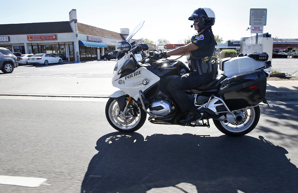 Garden Grove Police Department motorcycle officer Katherine Anderson patrols the city's streets on her BMW bike. Photo by Christine Cotter