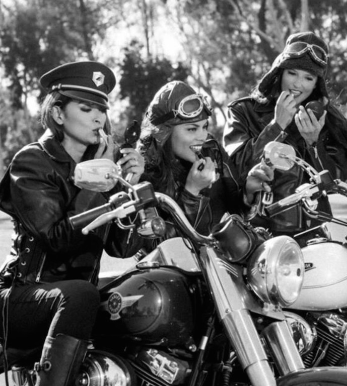 Katherine Anderson (left) and good friends and fellow motor officers Irene Gomez (center) of the Santa Ana PD and Jennifer Metoyer of the Murrieta PD prepare for a remake of a vintage motorcycle picture. Photo courtesy of Katherine Anderson
