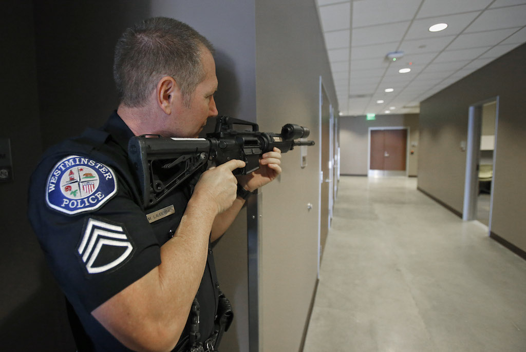 Westminster Police Sgt. Mark Lauderback in an active shooter drill in conjunction with the OC Fire Authority.  Photo by Christine Cotter