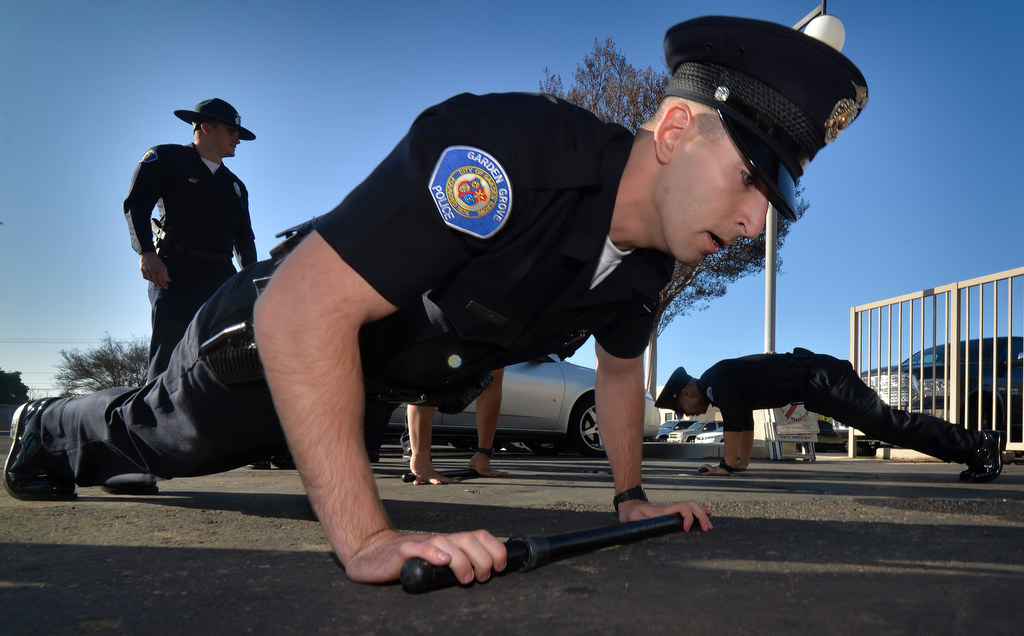 Garden Grove PD Recruit Josh Behzad does pushups during a pre-academy drill session at GGPD. Photo by Steven Georges/Behind the Badge OC