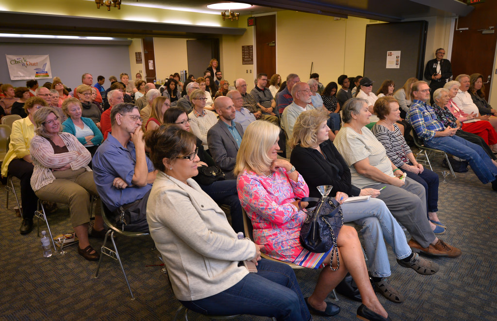 Anaheim Public Library audience members fill the room to listen to Anaheim detectives discuss the book Maltese Falcon and how it relates to real crime detective work. Photo by Steven Georges/Behind the Badge OC