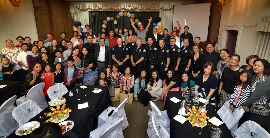 Anaheim PD officers gather with members of Iglesia Ni Cristo (Church of Christ) in Anaheim for a group photo at the church after inviting the officers for a meal during Anaheim Law Enforcement Appreciation Day. Photo by Steven Georges/Behind the Badge OC