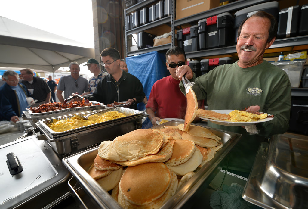 Rocky Audley, an Anaheim Fire & Rescue Captain who retired in 2013, right, lines up for breakfast at Anaheim Fire Station 6 for the annual retiree breakfast. Photo by Steven Georges/Behind the Badge OC