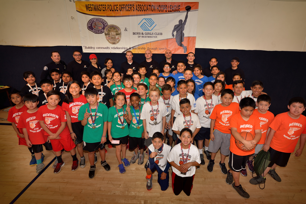 Hoops Basketball League teams gather at the conclusion of the WPOA Hoops Basketball League tournament at the Boys & Girls Club of Westminster. Photo by Steven Georges/Behind the Badge OC