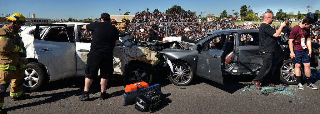 A simulated head-on car collision is staged on front of students at Anaheim High School, part of the Every 15 Minutes program. Photo by Steven Georges/Behind the Badge OC