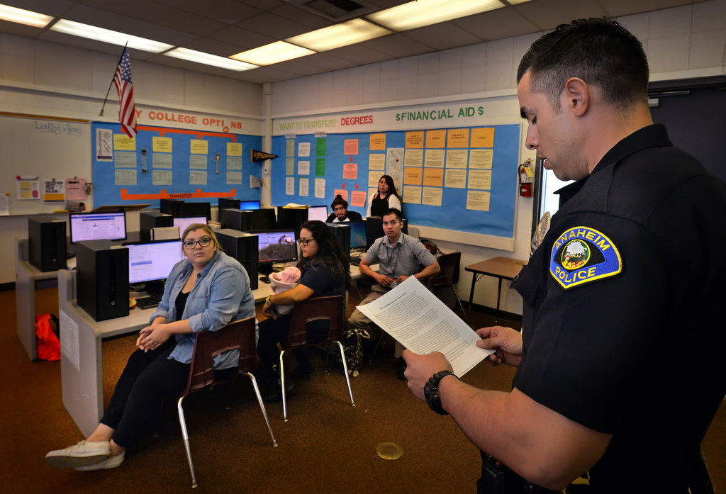 Anaheim Police Officer F. Ramirez reads the simulated obituary of Carlos Garcia to students at Anaheim High, part of the Every 15 Minutes program. Photo by Steven Georges/Behind the Badge OC