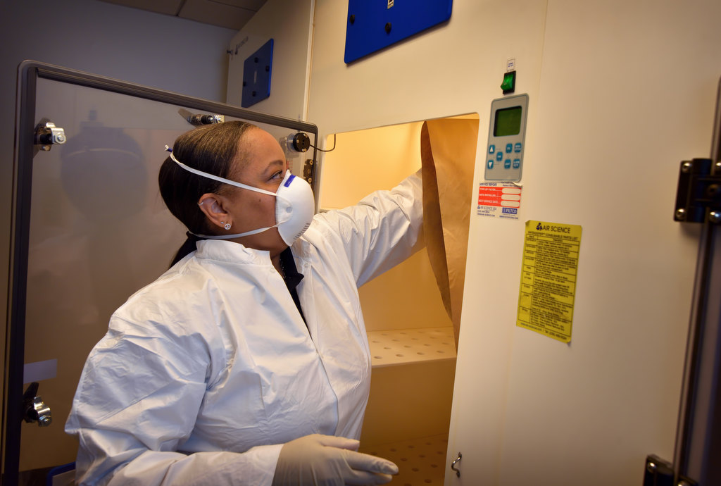 Dawn Scruggs, of the Fullerton PD’s CSI department, in a special blood drying room used to preserve the blood found on clothes for evidence. Photo by Steven Georges/Behind the Badge OC