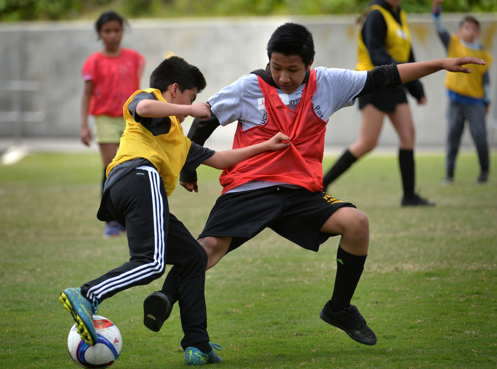 Kids play the final match of the OC GRIP soccer camp at Cal State Fullerton’s soccer stadium. Photo by Steven Georges/Behind the Badge OC