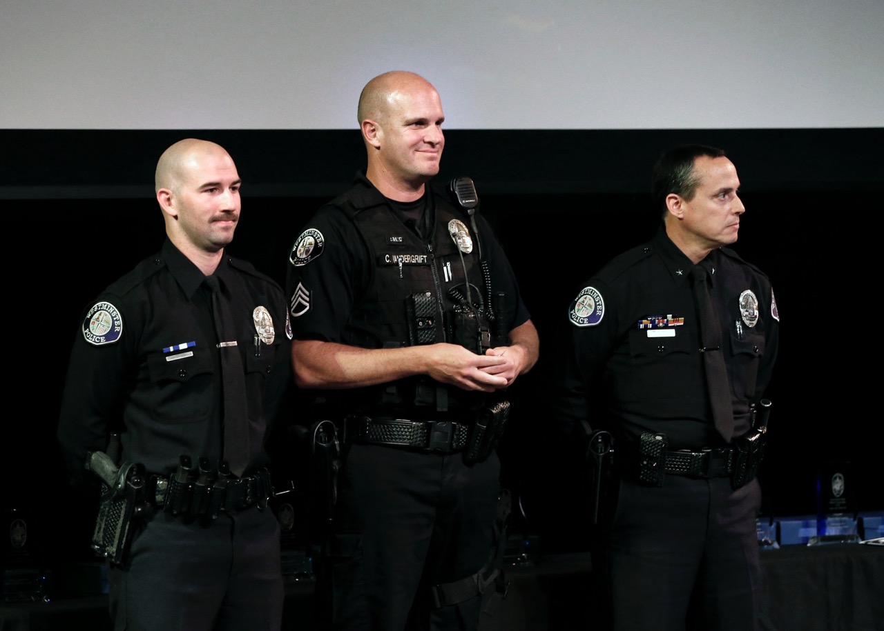 From left: Officer David Skube, Sgt. Cord Vandergrift, Cmdr. Al Panella and Sgt. Eddie Esqueda (not pictured) receive the Award of Excellence at a ceremony Feb. 24. Photo by Christine Cotter/Behind the Badge OC