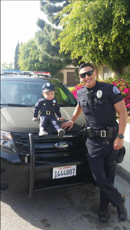 A Facebook photo that showed Officer Mike Gradilla with 3-year-old Tayden Nguyen went viral after the Westminster Police Department posted it Saturday. Photo courtesy the Westminster Police Department. 