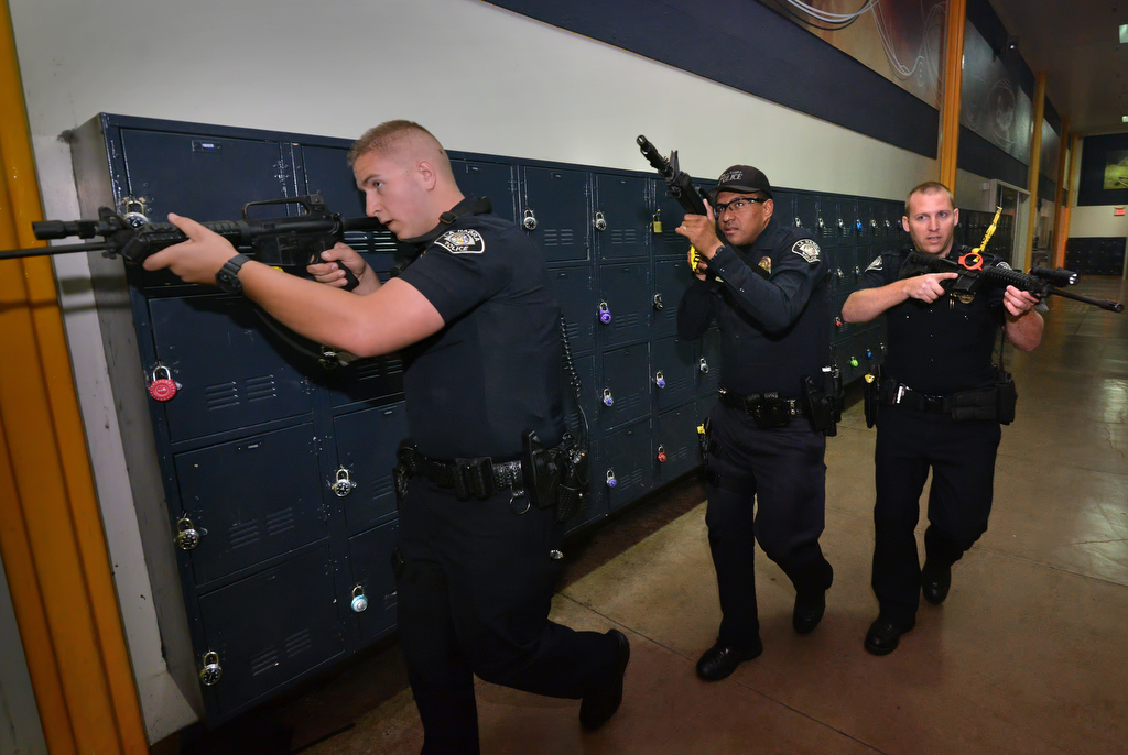 La Habra PD officers check out the hallways and room after room during an active shooter drill at Sonora High School. Photo by Steven Georges/Behind the Badge OC