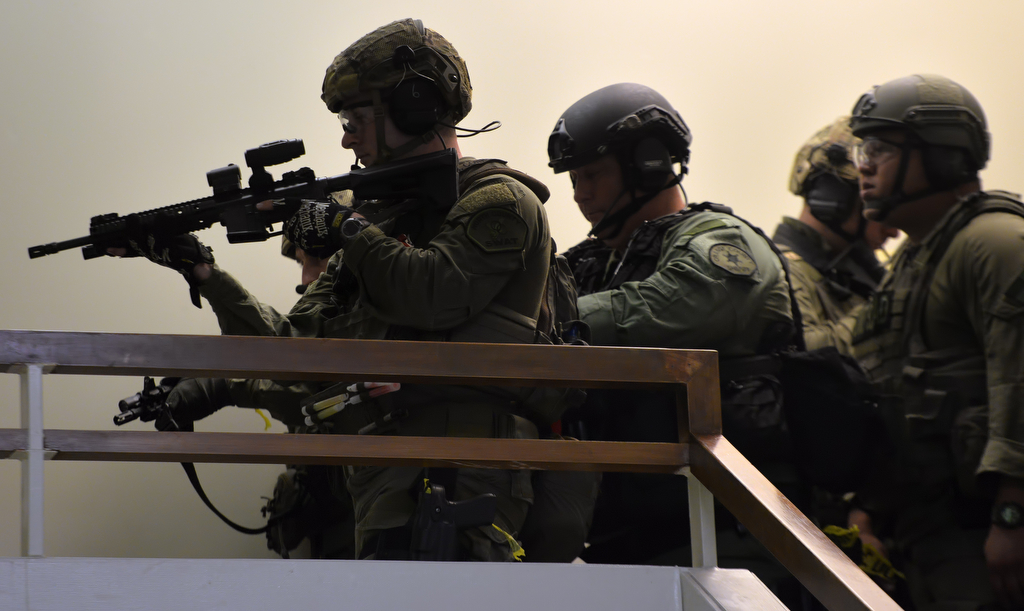 Members of North County SWAT approach a room where the bad guy is held up during an active shooter drill at Sonora High School. Photo by Steven Georges/Behind the Badge OC