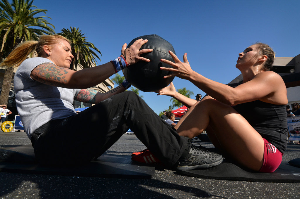 Merisa Leatherman, left, and Melisa Nelson of Anaheim PD’s team For Him Gear compete against time during the 2nd Annual APD Guns N Hoses Fitness Competition. Photo by Steven Georges/Behind the Badge OC