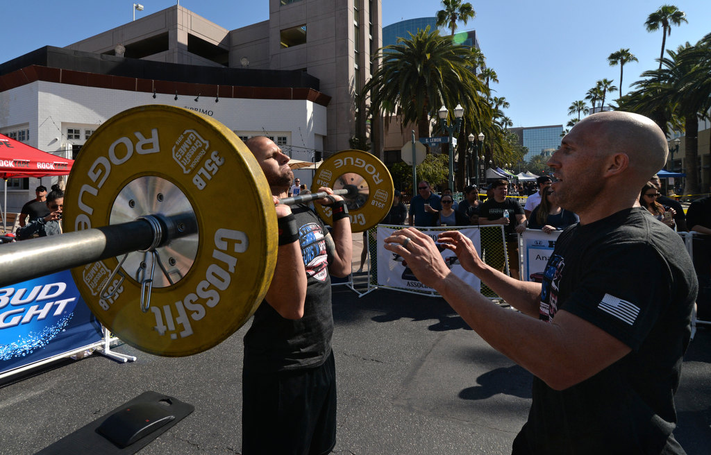 Anaheim PD’s Ryan Killeen, left, and Rory Rexroad of Murrieta Fire, team Norco Boys, compete in the 2nd Annual APD Guns N Hoses Fitness Competition. Photo by Steven Georges/Behind the Badge OC