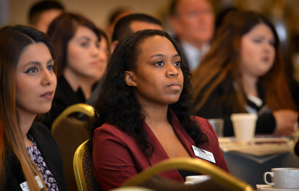 Attendees listen to a seminar titled, Beneath the Surface: Human Trafficking in Orange County, including Patricia Harris, restitution specialist, victim assistance programs, for Community Service Programs, center (red jacket), during the 12th Annual Victims’ Rights Conference at the Embassy Suites in Garden Grove. Photo by Steven Georges/Behind the Badge OC