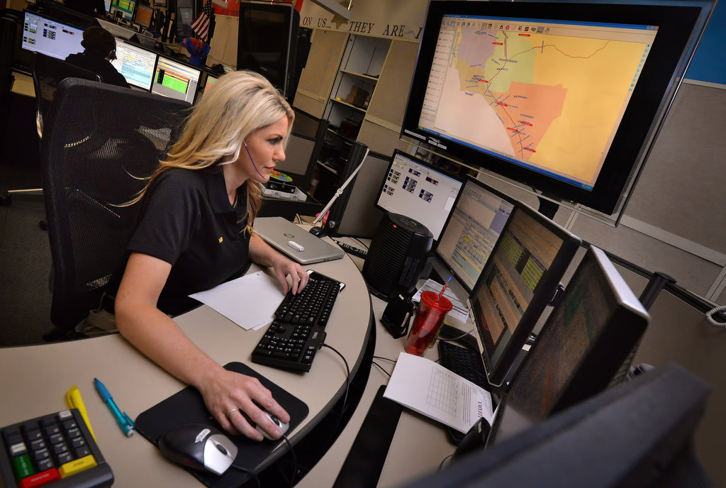 Stephany Gardner, dispatcher for the Orange County Sherif Department, works at her station at the Loma Ridge Emergency Operations Center. Photo by Steven Georges/Behind the Badge OC