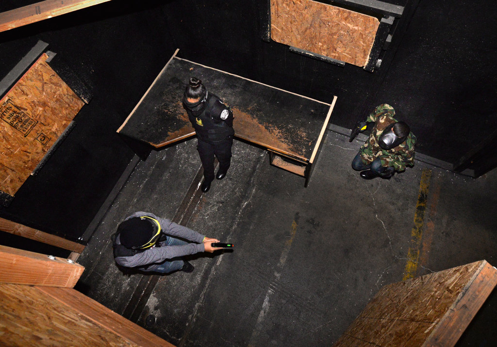 A citizen walks through the Shoot Or DonÕt Shoot Law Enforcement Challenge maze at Tac City Airsoft in Fullerton as Buena Park PD Explores setup scenarios where they need to decide in a split second who the suspect and the victim is. Photo by Steven Georges/Behind the Badge OC