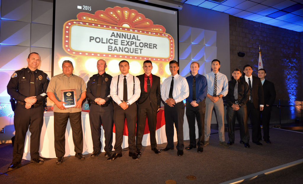 Officer Lino Santana, second from left, is presented with the Advisor of the Year award as he stands on stage with those explorers involved with the Chandler Tactical Competition in Arizona. Photo by Steven Georges/Behind the Badge OC