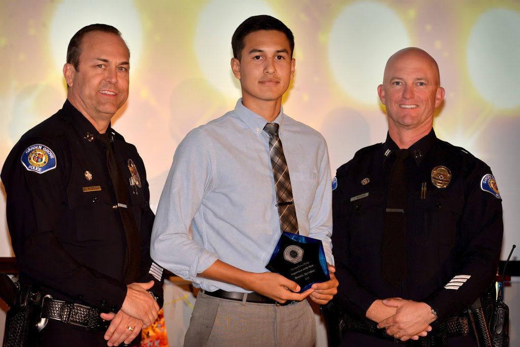 Garden Grove PD Explorer Daniel Alvarez, accepts the  Supervisor of the Year award from Capt. Kevin Boddy, left, and Capt. Travis Whitman during the Garden Grove Police Explorers awards banquet. Alvarez also received the Explorer of the Year and Most Inspirational awards. Photo by Steven Georges/Behind the Badge OC