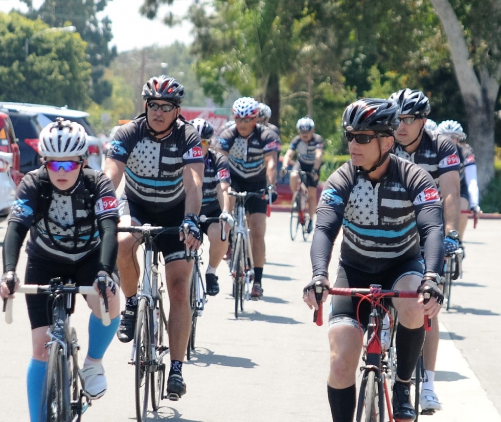 Cyclists pedal towards the Westminster Police Department's fallen officer memorial, ending their 630-mile trek from Sacramento. The cyclists are police officers who made the trip to raise money for family members of officers who died in the line of duty. Photo by Lou Ponsi/Behind the Badge OC. 
