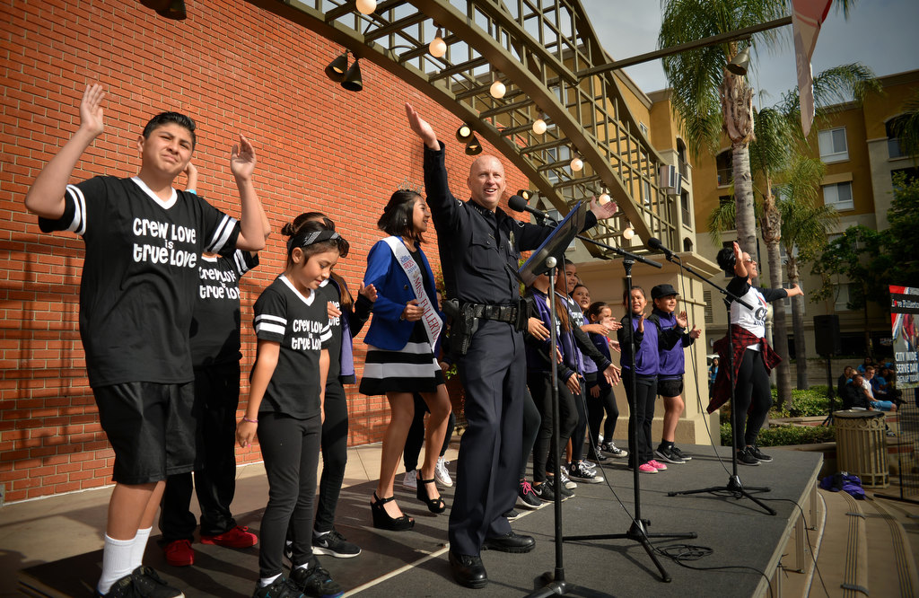 Fullerton Police Chief Dan Hughes warms the crowd up during the opening rally of Love Fullerton at FullertonÕs downtown plaza. Photo by Steven Georges/Behind the Badge OC