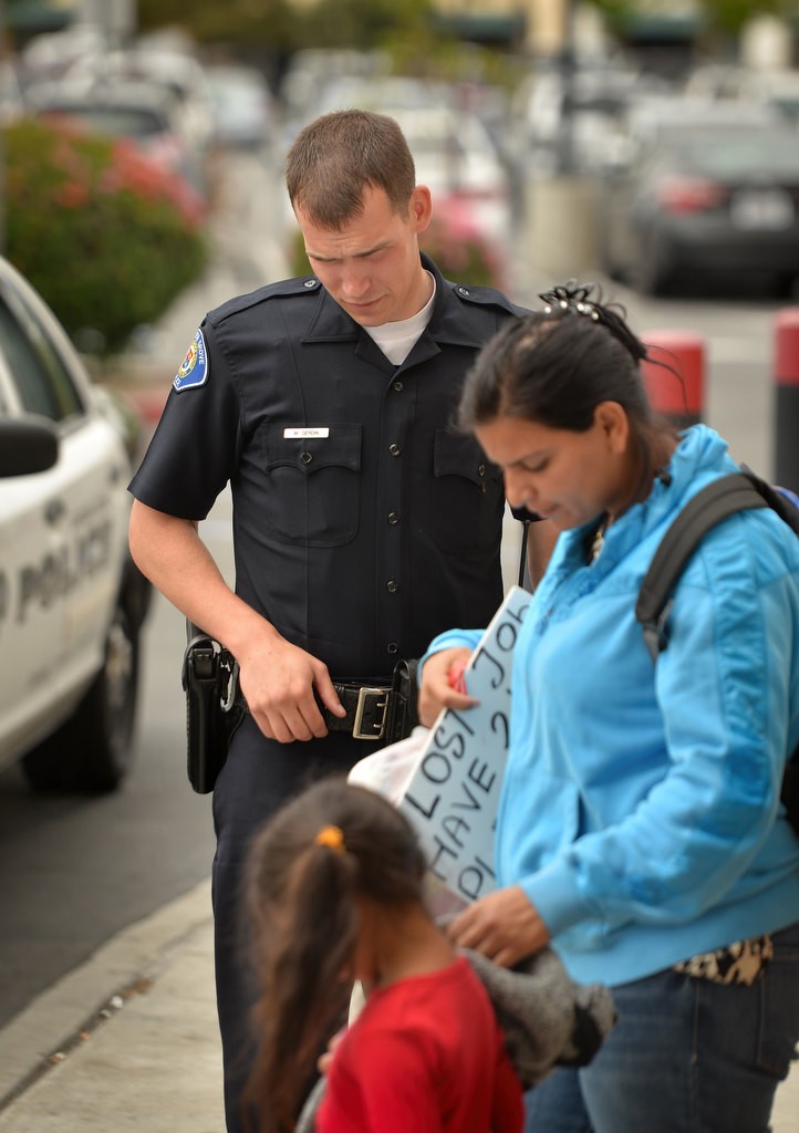 Garden Grove PD Officer Michael Gerdin responds to a call of a women panhandling at Eastgate Plaza Shopping Center. Photo by Steven Georges/Behind the Badge OC